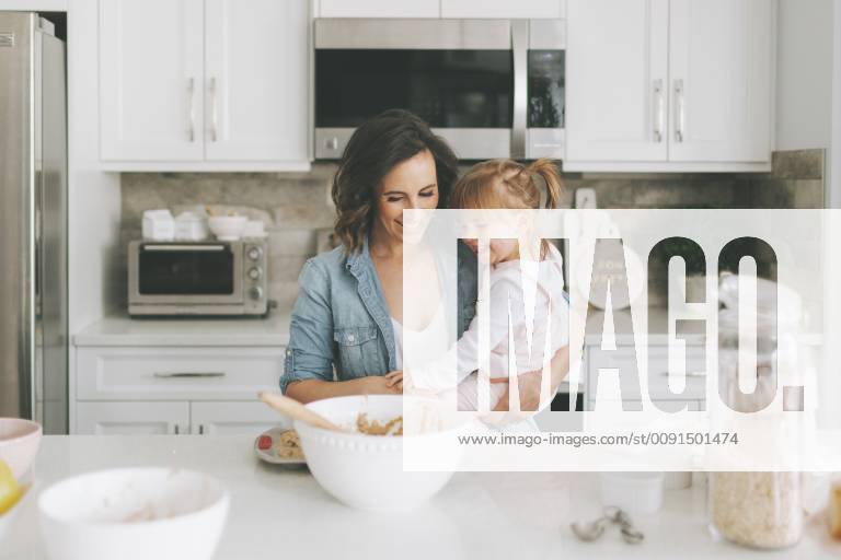 Mother and daughter making a cake together model released Symbolfoto property released CMSF00039