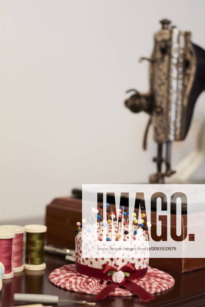 Old vintage sewing machine with pin chusion in shape of a hat property released IGGF01027