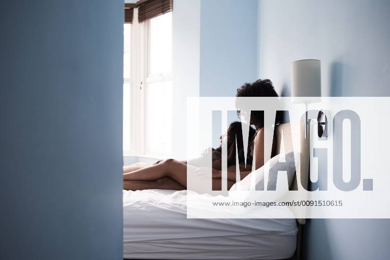 Affectionate young couple in bed model released Symbolfoto property released IGGF01074