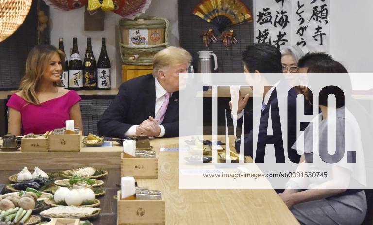 Trump in Japan Japanese Prime Minister Shinzo Abe (3rd from L) and U.S. President Donald Trump (2nd from L) dine at a Japanese charcoal grill restaurant in Tokyo on May 26, 2019. Accompanied by their respective wives -- Akie (R) and Melania (L) -- the Japanese and U.S. leaders had dinner at Inakaya in the glitzy Roppongi district on the eve of their summit talks.
