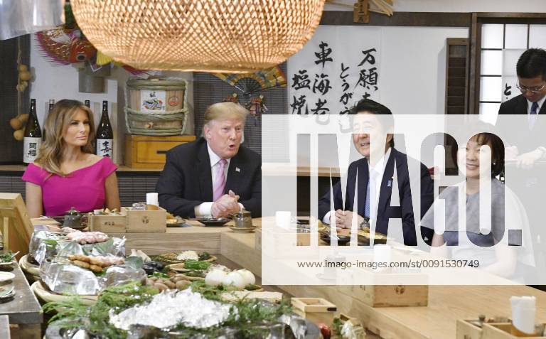 Trump in Japan Japanese Prime Minister Shinzo Abe (2nd from R) and U.S. President Donald Trump (3rd from R) dine at a Japanese charcoal grill restaurant in Tokyo on May 26, 2019. Accompanied by their respective wives -- Akie (R) and Melania (L) -- the Japanese and U.S. leaders had dinner at Inakaya in the glitzy Roppongi district on the eve of their summit talks.