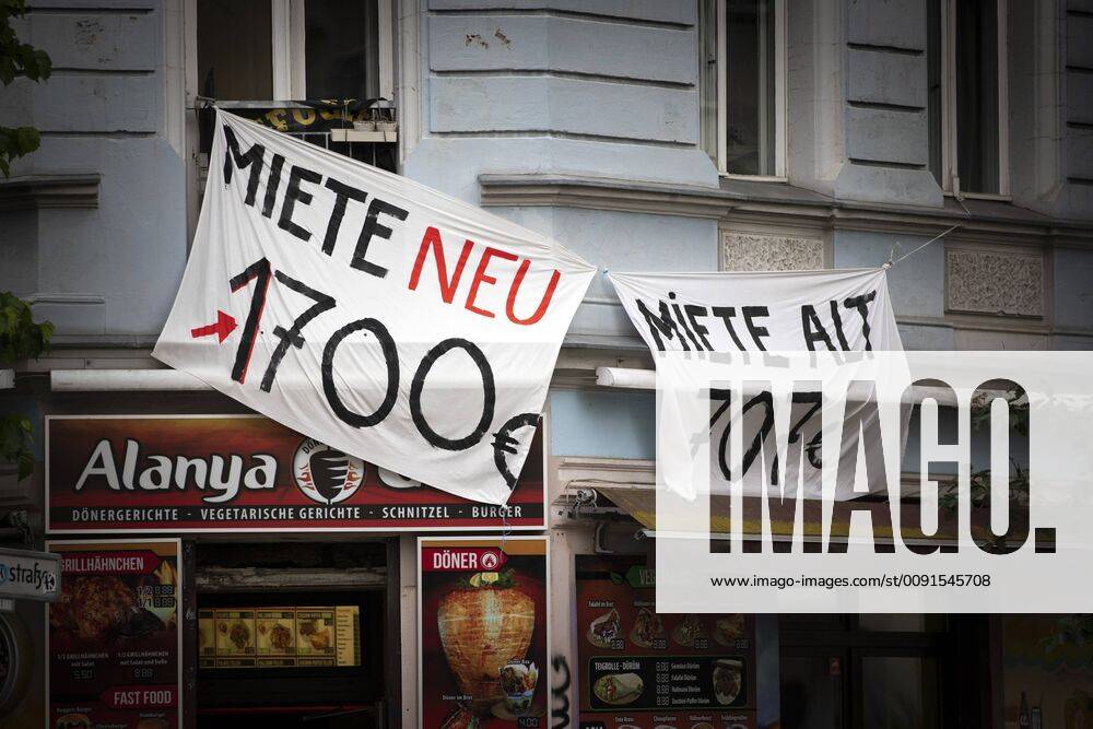Two banners with the inscription Miete neu 1700 Euro, Miete alt 707 Euro hang on a house façade Berlin, 27 05 2019 Berlin Germany