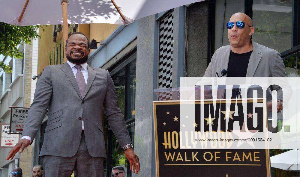 Director F. Gary Gray reacts to comments by actor Vin Diesel during an unveiling ceremony honoring him with the 2,665th star on the Hollywood Walk of Fame in Los Angeles on May 28, 2019. LAP2019052802 JIMxRUYMEN