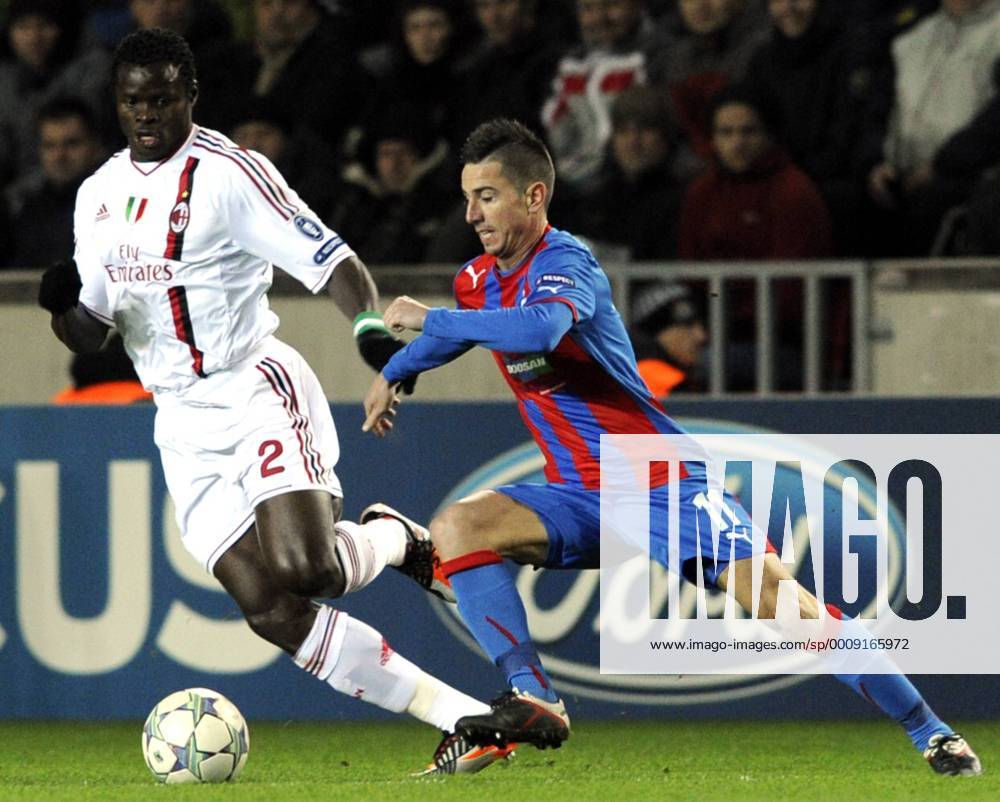 Taye Taiwo of Milan (left) and Vaclav Pilar of Viktoria during their final Champions League group H soccer match FC Viktoria Plzen vs AC Milan at Synot Tip Arena Eden stadium in Prague, Czech Republic, Tuesday, December 6, 2011. (CTKxPhoto VitxSimanek) CTKPhoto020201112060993401