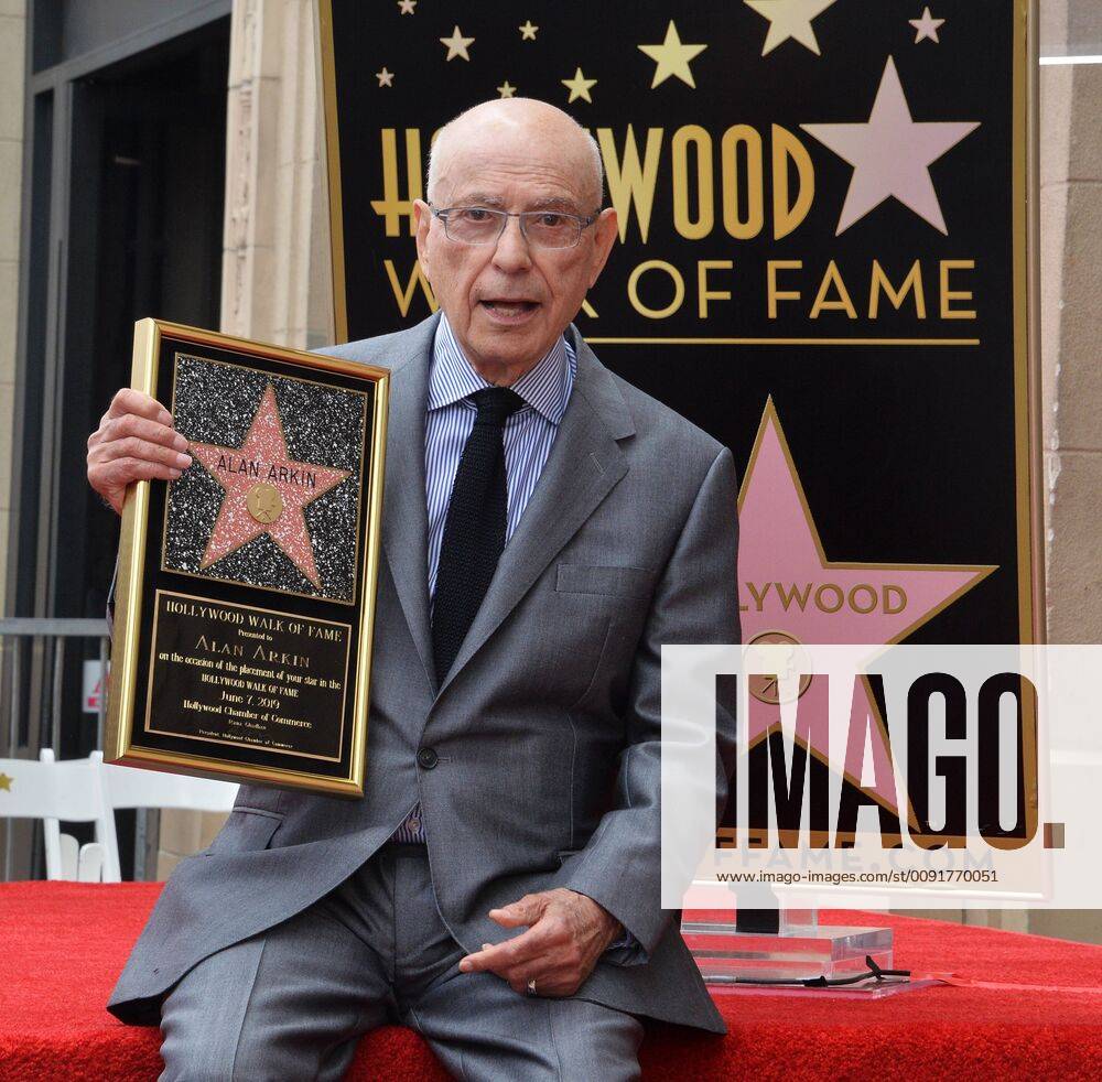 Actor Alan Arkin holds a replica plaque during a ceremony honoring him with the 2,665th star on the Hollywood Walk of Fame in Los Angeles on June 7, 2019. LAP2019060709 JIMxRUYMEN