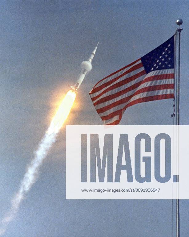 June16, 1969 - Kennedy Space Center, Florida, U.S. - The American flag heralded the launch of Apollo 11, the first Lunar landing mission, on July 16, 1969. The massive Saturn V rocket lifted off from s Kennedy Space Center with astronauts Neil A. Armstrong, Michael Collins, and Edwin Buzz Aldrin at 9:32 a.m. EDT. Four days later, on July 20, Armstrong and Aldrin landed on the Moon s surface Kennedy Space Center U.S. - ZUMAz03_ 19690616_sha_z03_336