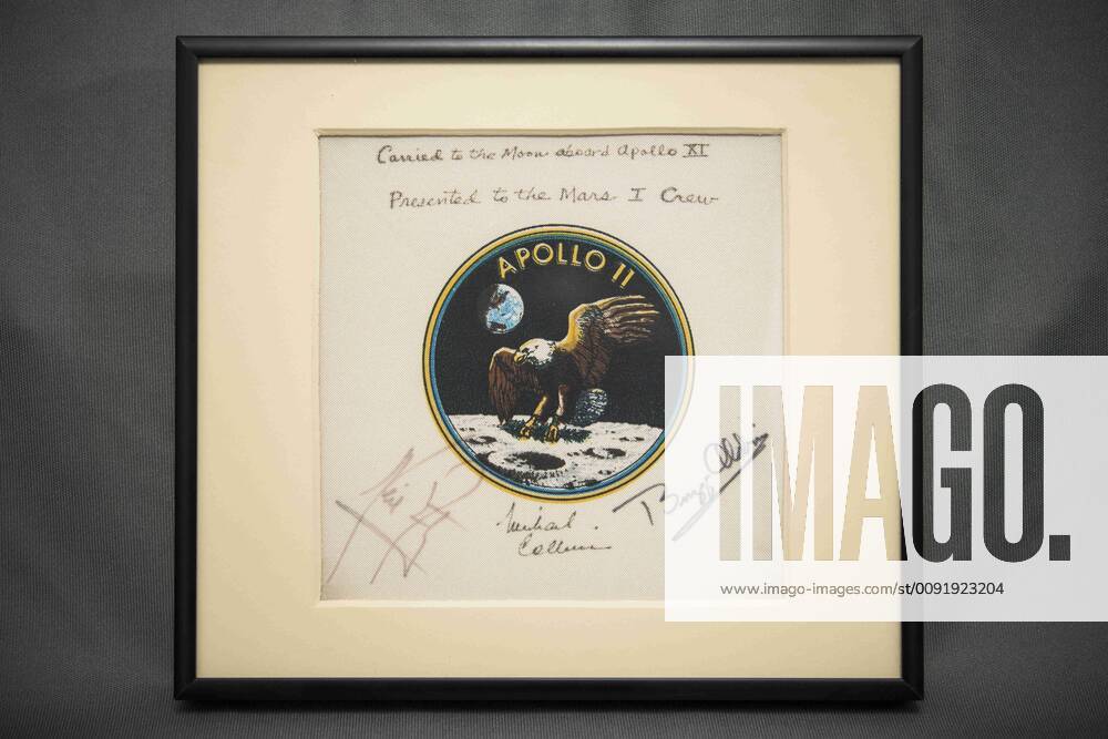 Washington, District of Columbia, U.S. - This framed Apollo 11 mission patch was presented to NASA s Kennedy Space Center during the July 21, 2014, when the center s Operations and Checkout Building was renamed the Neil Armstrong Operations and Checkout Building. The patch was flown aboard Apollo 11 in 1969. In 1987, all three crewmembers Neil Armstrong, Buzz Aldrin and Michael Collins signed the patch and presented it to former NASA Administrator James C. Fletcher for safekeeping until it could be presented to the first crew to land on Mars Washington U.S. - ZUMAz03_ 20140711_sha_z03_366