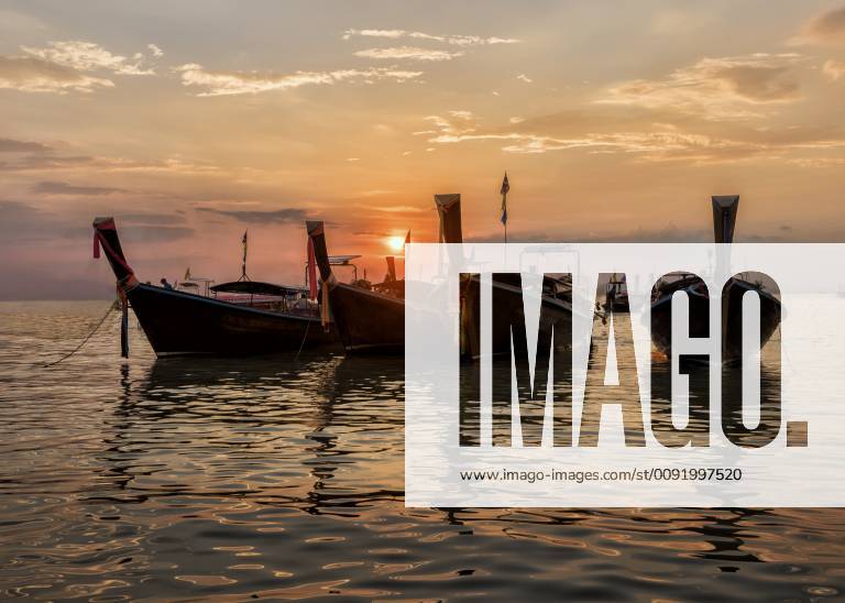 Thailand, Krabi, Railay beach, long-tail boats floating on water at sunset ALRF01174