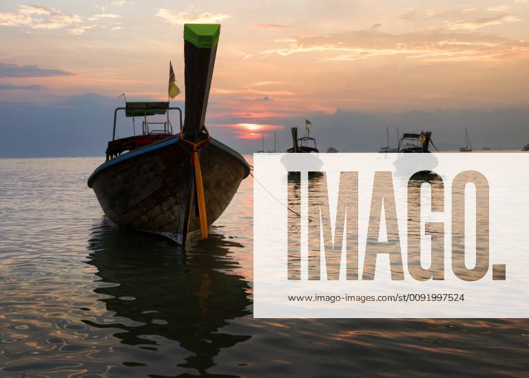 Thailand, Krabi, Railay beach, long-tail boats floating on water at sunset ALRF01177
