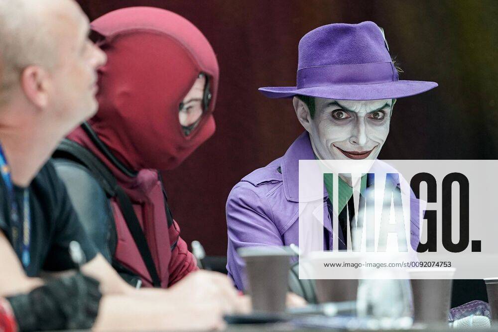 The Joker right as member of the jury at the Cosplay Contest at the Convention in the Atrium, Cosplayer kosupure , competition, fan in disguise, fans, nerds, disguise trend, science fiction, 30 06 2019, Stuttgart Germany , Event, Messe, CCON, Comic Con Germany 2019 Stuttgart