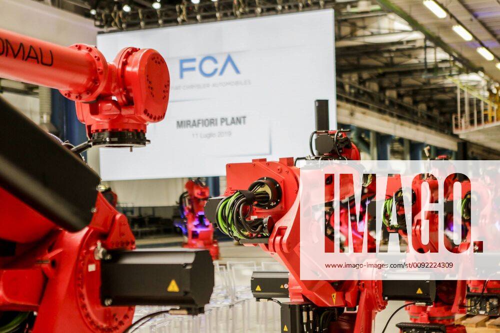 Turin Fiat Mirafiori factories. Event during the installation of the first robot on the Fiat 500 BEV fitting line. Comau robot exhibition. (Giulio Lapone Fotogramma, turin - 2019-07-11) p.s. la foto e utilizzabile nel rispetto del contesto in cui e stata scattata, e senza intento diffamatorio del decoro delle persone rappresentate