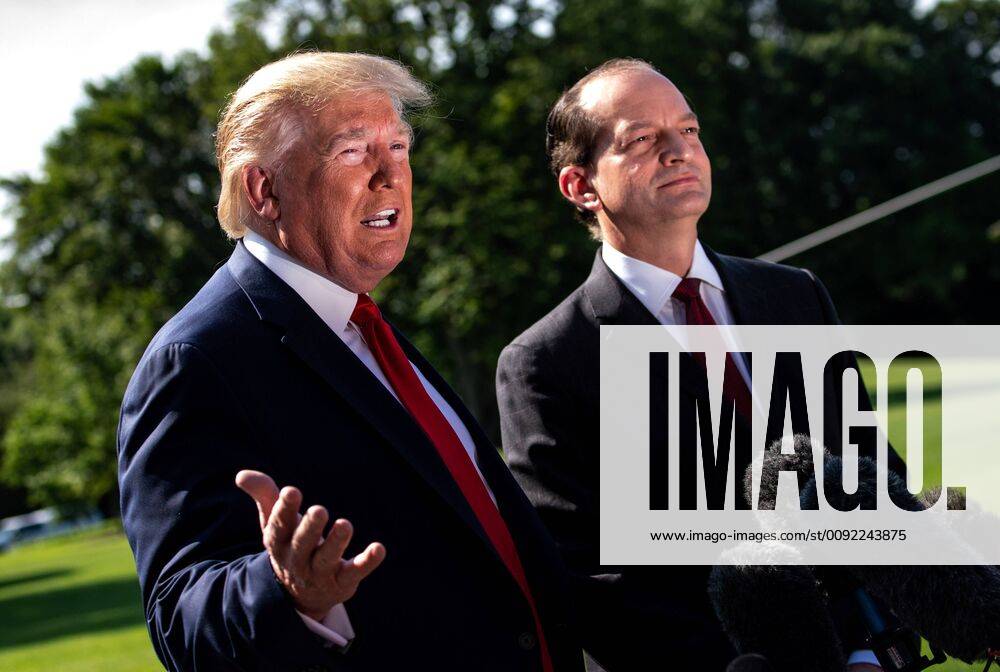 President Donald Trump speaks alongside Labor Secretary Alex Acosta after Acosta announced his resignation, as Trump departs the White House in Washington, D.C. on July 12, 2019. Acosta announced his resignation amid pressure from the Jeffrey Epstein sex trafficking case. WAP20190712303 KEVINxDIETSCH