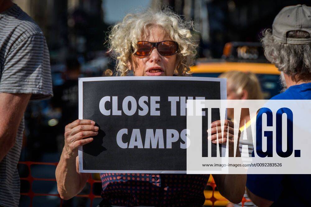 New York, USA - More than 40 members of the direct action group Rise and Resist were arrested after shutting down rush hour traffic at the intersection of 42nd Street and Fifth Avenue in the heart of New York City on July 15, 2019 advocating for immigrantsâ€⠢ rights and demanding the public wake up, take action, and end the border crisis terror and the terror inflicted on immigrant communities. Activists held three banners that read, â€oeClose the Campsâ€Â, â€oeNo Raidsâ€Â, and â€oeAbolish ICEâ€Â. Some members also wore fluorescent work vests with the words â€oeAbolish ICE. USA - ZUMAm432 20190715_znp_m432_001