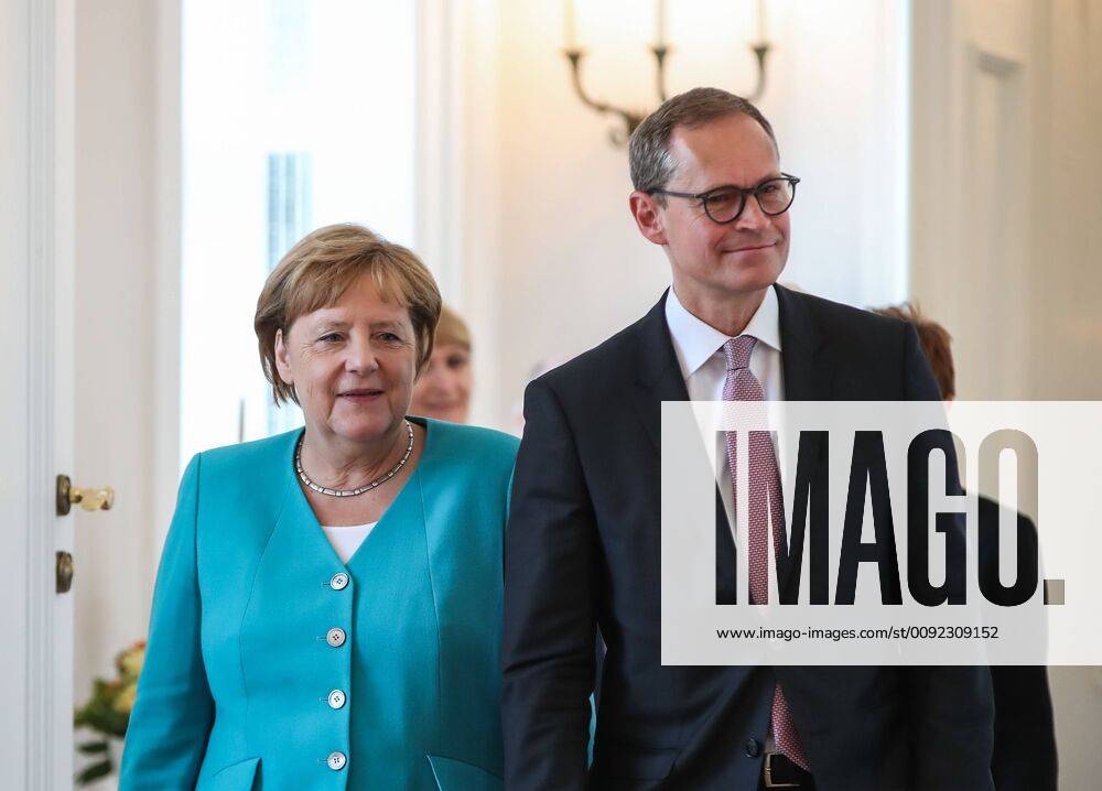 (190717) -- BERLIIN, July 17, 2019 -- German Chancellor Angela Merkel (L) and Michael Mueller, deputy president of the Bundesrat and Berlin s head of government, arrive for a ceremony for the appointment of German Defense Minister at the Bellevue Palace in Berlin, capital of Germany, July 17, 2019. The leader of the German ruling party Christian Democratic Union (CDU) , Annegret Kramp-Karrenbauer, was appointed new German Minister for Defense on Wednesday. ) GERMANY-BERLIIN-KRAMP-KARRENBAUER-DEFENSE MINISTER-INAUGURATION ShanxYuqi