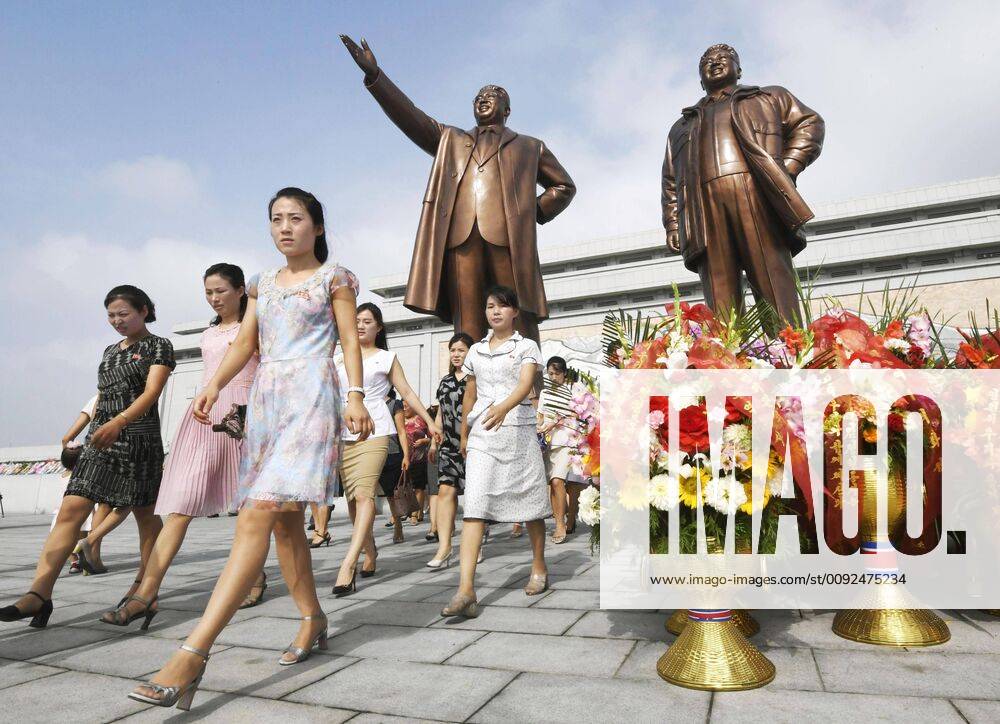 KW30 66th anniversary of Korean War armistice People are pictured after offering flowers at statues of former North Korean leaders Kim Il Sung (L) and Kim Jong Il at Pyongyang s Mansu Hill on July 27, 2019, the 66th anniversary of the suspension of open hostilities in the Korean War in 1953.
