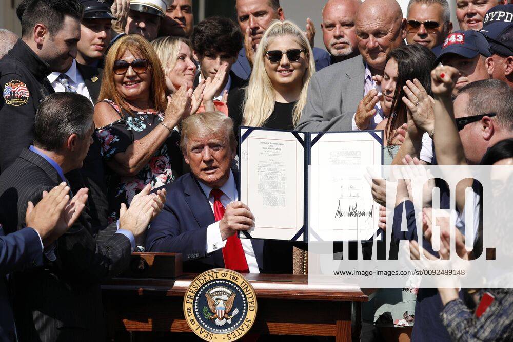 9 11 responders react after U.S. President Donald Trump signed an act to permanently authorize the September 11th victim compensation fund, in the Rose Garden of the White House in Washington on Monday, July 29, 2019. WAPG2019072905 YURIxGRIPAS