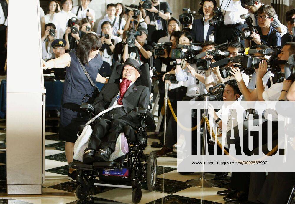 KW31 Japanese lawmaker with disabilities Newly elected lawmaker Yasuhiko Funago, a sufferer of amyotrophic lateral sclerosis, watches on as his aide presses a button on the attendance board at the parliament building in Tokyo on Aug. 1, 2019, before entering an extraordinary Diet session. Funago, of the anti-establishment Reiwa Shinsengumi party, won a seat in the July 21 upper house election.