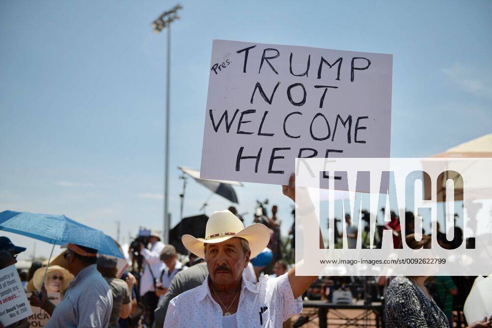 ASEC -- Miguel DeAnda, 81, of El Paso, demonstrates at Washington Park as President Donald Trump visits the city in the wake of a mass shooting. USA - ZUMAab1_ 20190807_zaf_ab1_023