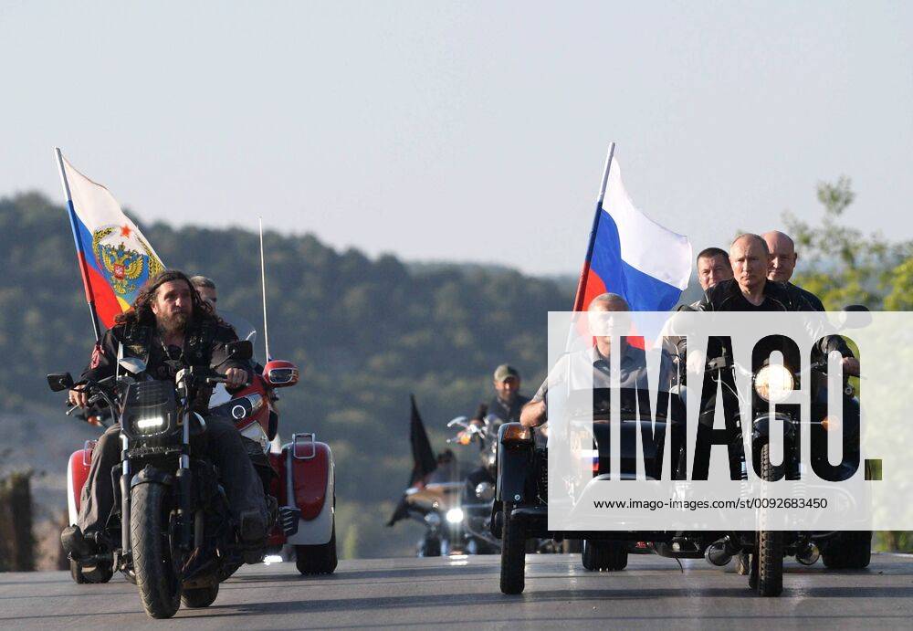 The leader of the Nochnye Volki (Night Wolves) motorcycle club, Alexander Zaldostanov (nicknamed Khirurg), left front, the Head of Russia s Republic of Crimea, Sergei Aksyonov (C, in the sidecar), and the President of Russia Vladimir Putin (R front) ride motorcycles at the Ten Vavilona (Shadow of Babylon) biker show at Mount Gasfort in Sevstopol. Alexei Druzhinin Russian Presidential Press and Information Office TASS TS0B60A9