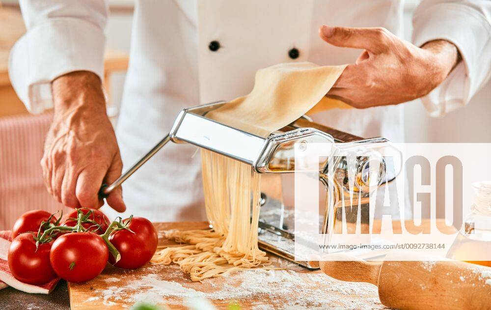Italian chef making homemade spaghetti pasta