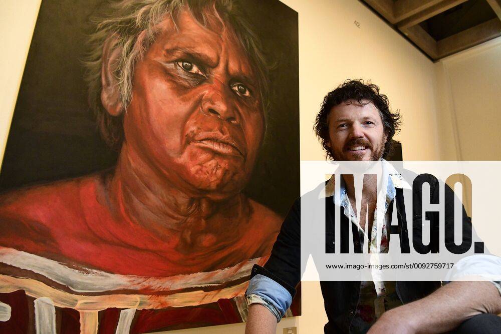 ARCHIBALD PEOPLE?S CHOICE AWARD, Artist David Darcy poses for a photograph in front of his portrait of Aboriginal Elder Daisy Tjuparntarri Ward at the Art Gallery of NSW in Sydney, Wednesday, August 14, 2019. David Darcy s portrait of Daisy, Tjuparntarri - Women s Business , has won the 2019 Archibald People s Choice award. ( NO ARCHIVING, , NO USE IN BOOKS WITHOUT CONSENT SYDNEY NSW AUSTRALIA