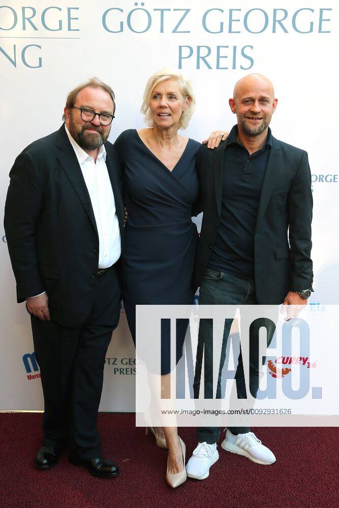Award GOETZ GEORGE PRIZE 2019 Gustav Peter Woehler, Marika George and Juergen Vogel on the Red Carpet for the award of the GOETZ GEORGE PRIZE on 19 August 2018 in the Astor Film Lounge The endowed prize shall commemorate this lifes work of Goetz George Berlin Charlottenburg Berlin Germany