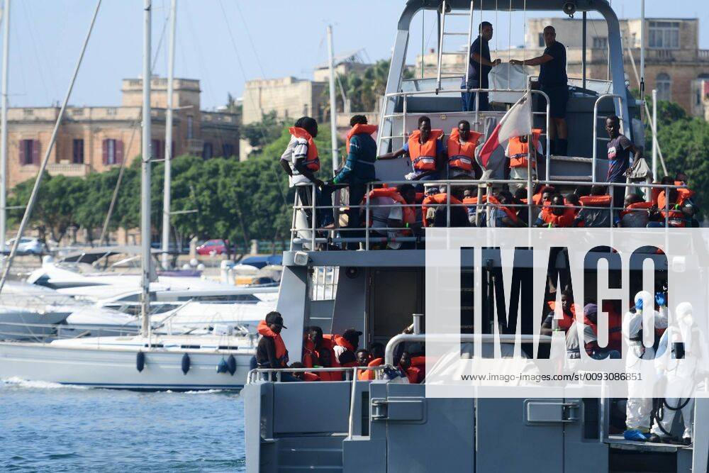 (190826) -- FLORIANA (MALTA), Aug. 26, 2019 -- Rescued migrants are seen on the Armed Forces of Malta s patrol boat P24 in Floriana, Malta, on Aug. 26, 2019. The Armed Forces of Malta brought in 73 migrants who were rescued off a rubber dinghy in the Maltese search and rescue region on Monday afternoon. (Photo by Xinhua) MALTA-FLORIANA-MIGRANTS-DISEMBARKATION JonathanxBorg