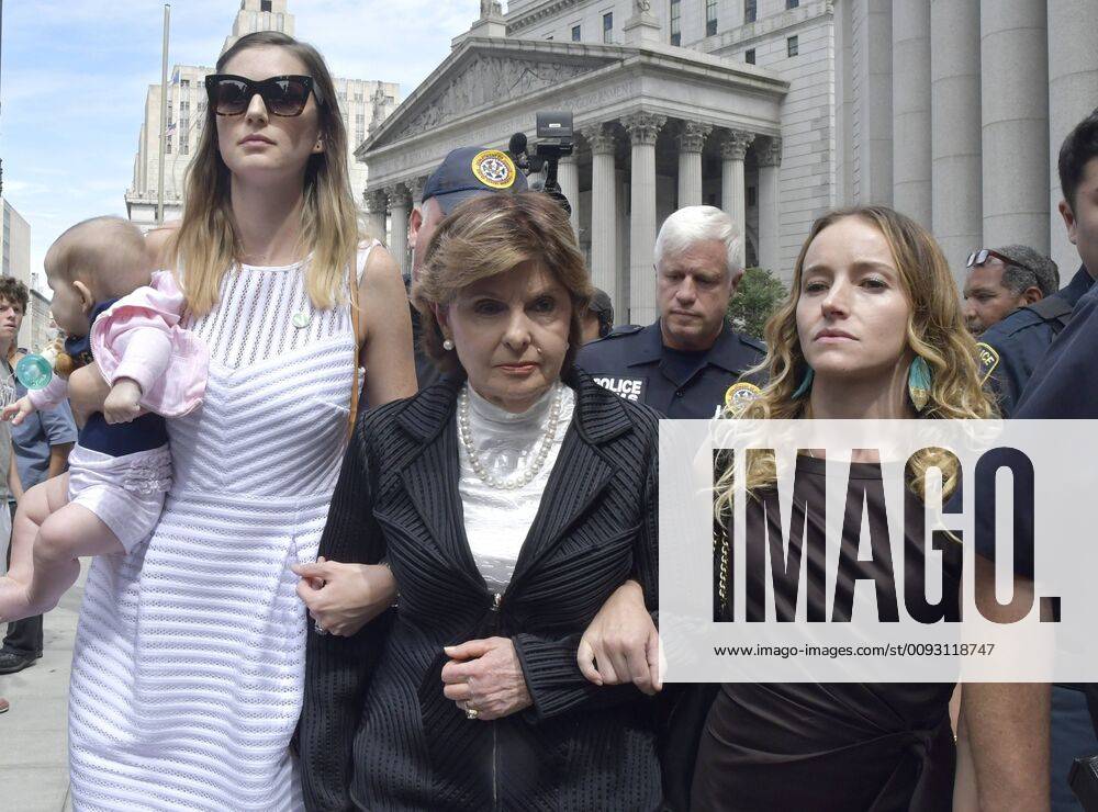 Alleged victims of billionaire Jeffrey EpsteinVirginia Teala Davies, right, and unidentified woman with baby exit Manhattan Federal Court with attorney Gloria Allred, Tuesday, July 27, 2019 in New York City. Epstein committed suicide while confined in the Manhattan Correctional Facility. NYP20190827812 LOUISxLANZANO