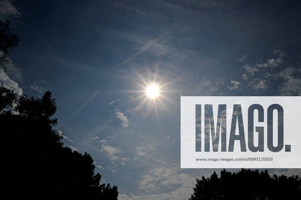 Heat wave and drought Gleißende sun between single small clouds in the sky before the formation of partly violent thunderstorms Essen Nordrhein Westfalen Germany