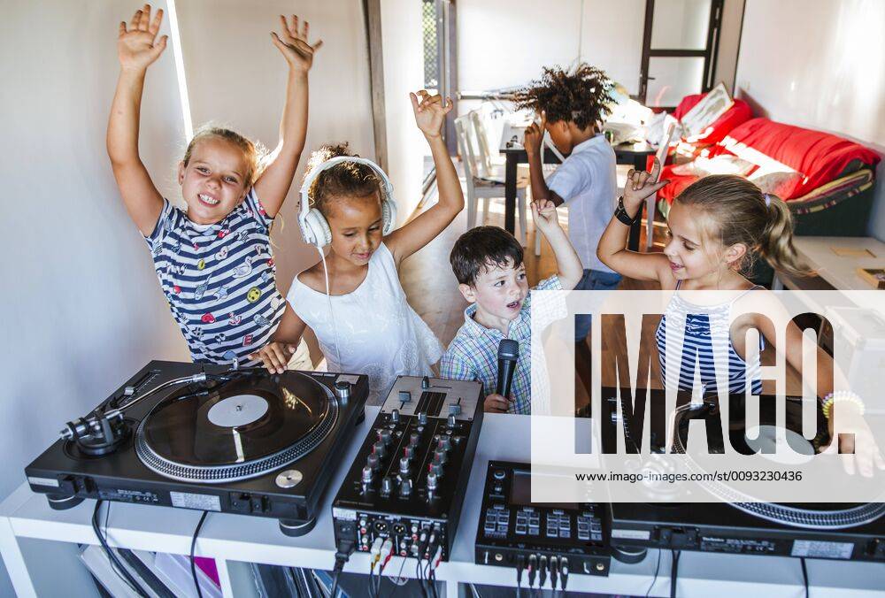 Young friends having a party at the turntable model released Symbolfoto property released LJF00547