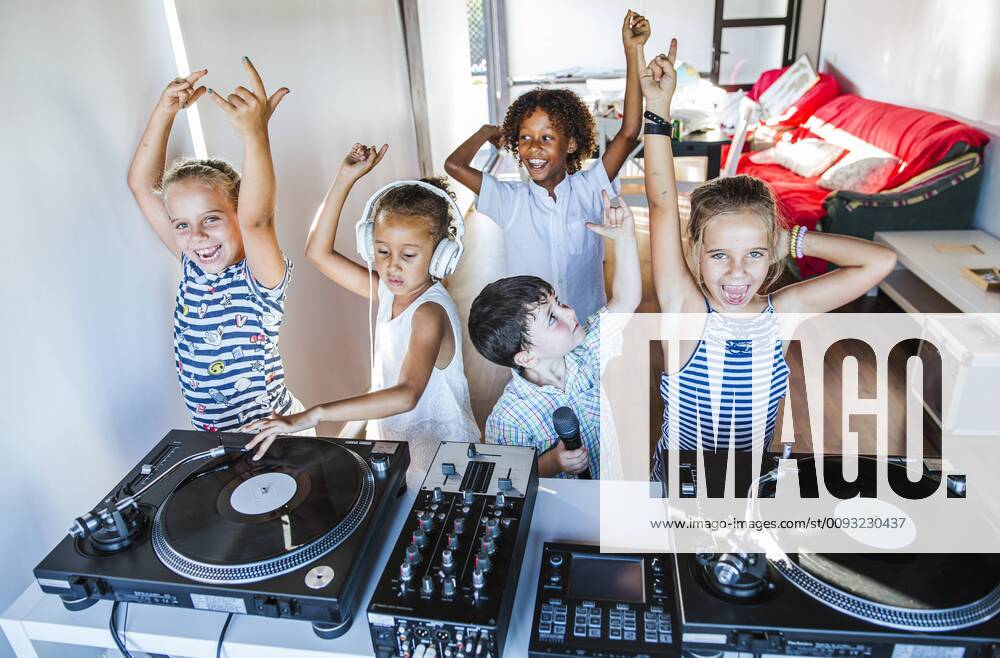 Young friends having a party at the turntable model released Symbolfoto property released LJF00548
