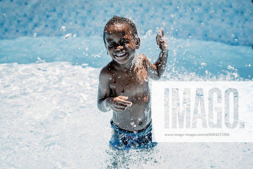Happy little boy in swimming pool model released Symbolfoto OCMF00526