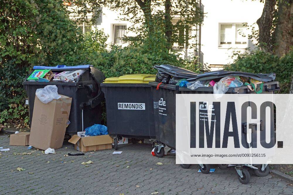 Disposal of household waste View of overfilled residual waste containers without waste separation on the roadside Essen North Rhine-Westphalia Germany