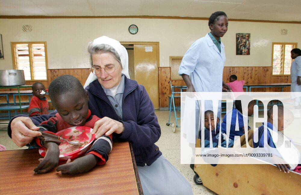 Naro Moru, Kenya Catholic Home for Handicapped Children 02 07 2005, Naro Moru, Mount Kenya, Kenya, KEN A Catholic sister helps a handicapped boy eat in a home for mentally and physically handicapped children Naro Moru Mount Kenya Kenya