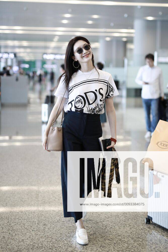 Chinese actress Jiang Shuying arrives at the Shanghai Pudong International Airport after landing in Shanghai, China, 11 September 2019...T-shirt: Tod s Shanghai China - ZUMAc43_ 20190911_zaf_c43_104