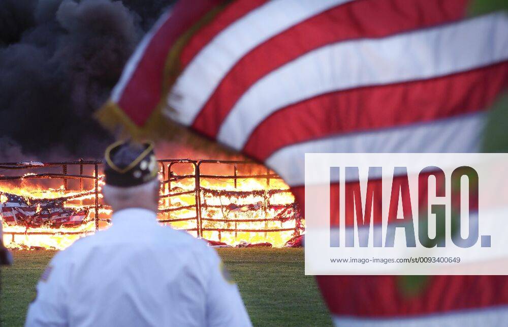 A member of a local American Legion Post watches as U.S. Flags are retired during a burning ceremony as part of a 9 11 Remembrance event attended by Nebraska Dakota County American Legion VFW posts, local fire and rescue departments, Dakota County Sheriffs s Dept., the South Sioux City Police Dept. and local residents at Freedom park in South Sioux City, Nebraska, Wednesday, September11, 2019. South Sioux City USA - ZUMAm41_ 20190911_zaf_m41_001