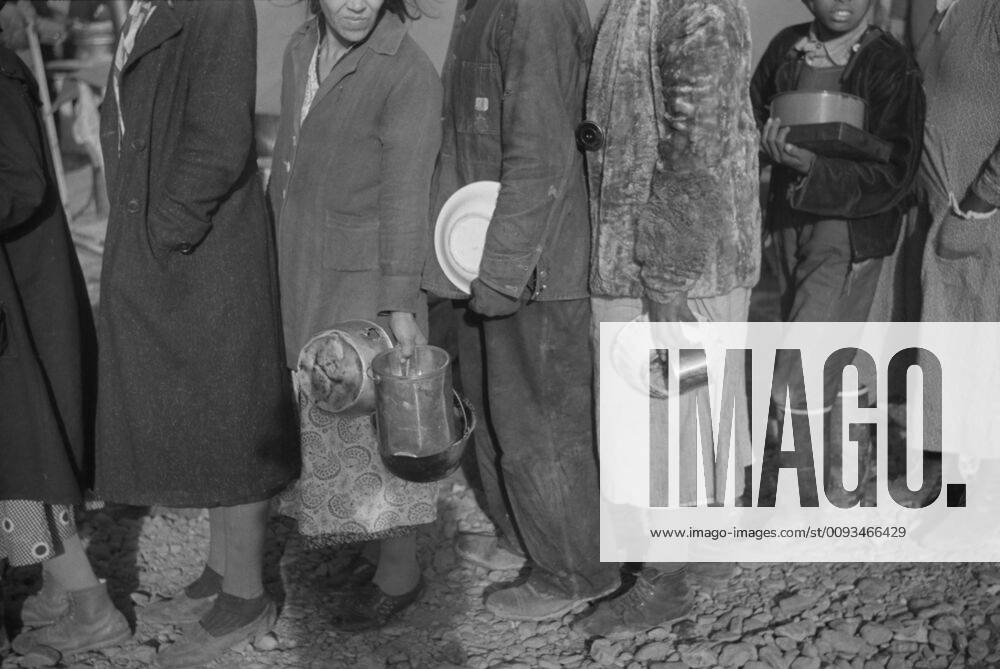 Group of People at Mealtime in Flood Refugee Camp, Forrest City, Arkansas, USA, Walker Evans for U.S. Resettlement Administration, March 1936
