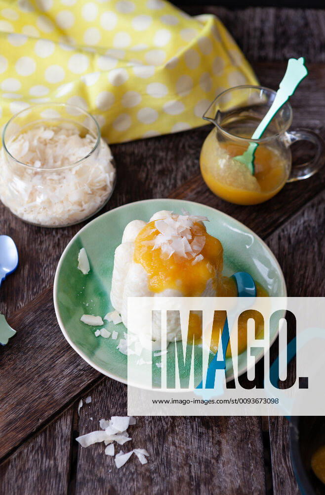 Exotic rice pudding with coconut and mango sauce 1079705824