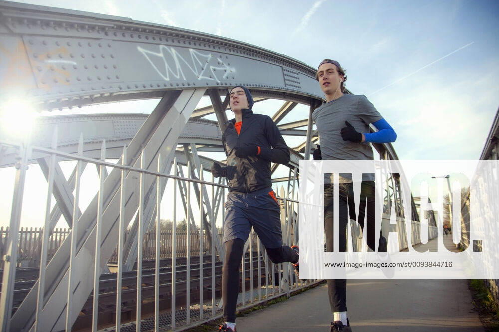 Two teenagers running over railway bridge model released Symbolfoto AJOF00005