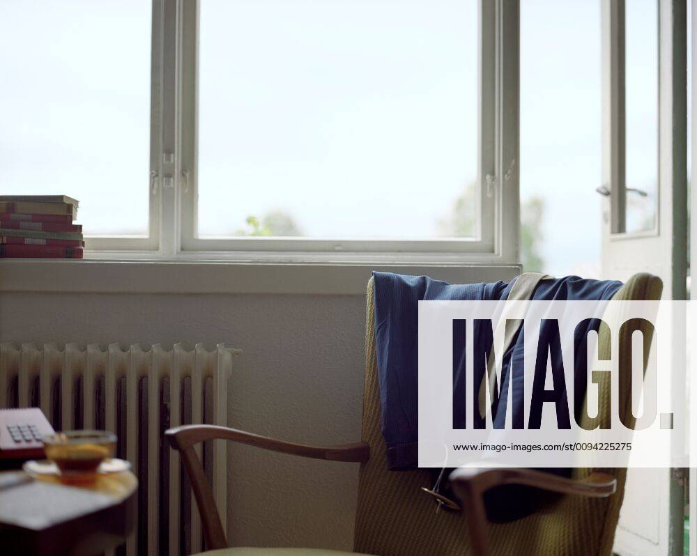Clothes Draped on Back of Armchair,property released 03B68871