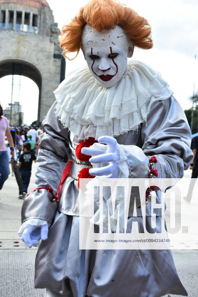 Annual Zombie Walk in Mexico City MEXICO CITY, MEXICO - OCTOBER 19: A man disguised as Pennywise (IT) is seen taking part during the march of annual Zombie Walk at Monumento of Revolucion on October 19, 2019 in Mexico City, Mexico
