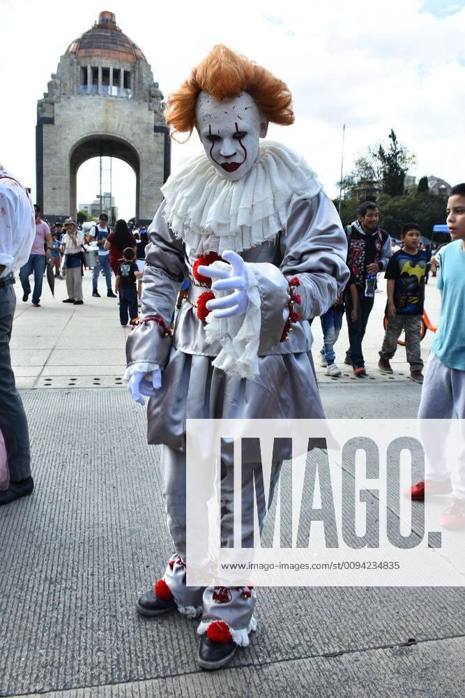 Annual Zombie Walk in Mexico City MEXICO CITY, MEXICO - OCTOBER 19: A man disguised as Pennywise (IT) is seen taking part during the march of annual Zombie Walk at Monumento of Revolucion on October 19, 2019 in Mexico City, Mexico