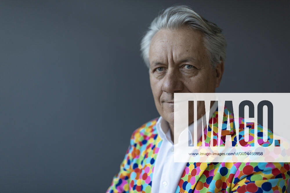 Portrait of a senior businessman wearing colorful sports jacket model released Symbolfoto property released GUSF02536