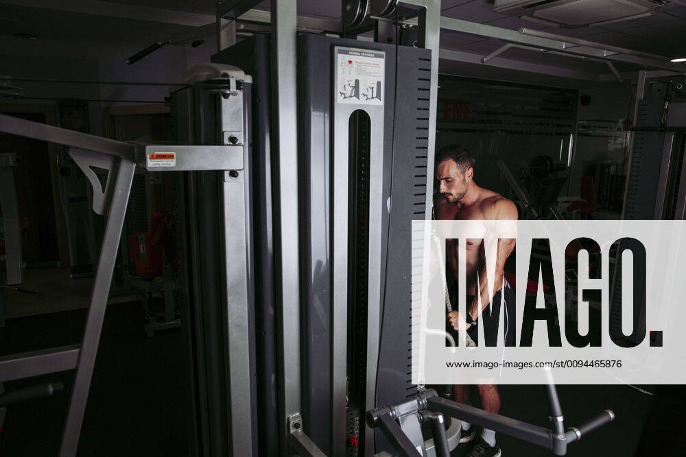 Muscular man training in gym model released Symbolfoto property released LJF00996