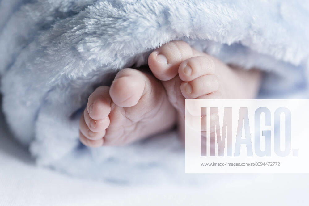 Close up of feet of a newborn baby model released Symbolfoto STBF00372