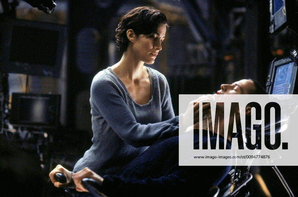 Carrie-Anne Moss & Keanu Reeves Characters: Trinity, Neo Film: The Matrix (USA AUS 1999) Director: The Wachowski Brothers 31 March 1999