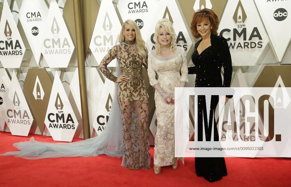 Reba McEntire (R), Dolly Parton (C) and Carrie Underwood arrive for the 52nd Annual Country Music Association Awards at Bridgestone Arena in Nashville, Tennessee Wednesday, November 13, 2019. NAP20191113510 JOHNxANGELILLO