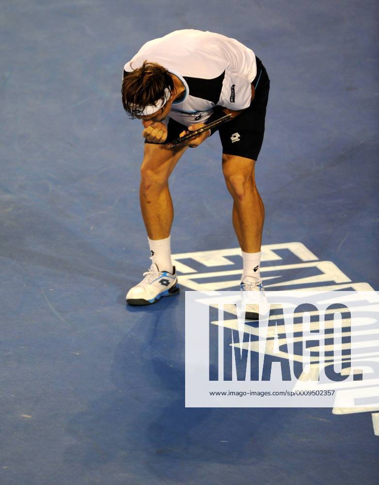 (120125) -- MELBOURNE, Jan. 25, 2012 (Xinhua) -- Spain s David Ferrer reacts during the men s singles quarterfinals match against Serbia s Novak Djokovic at the 2012 Australian Open tennis championship at Melbourne Park in Melbourne, Australia, Jan. 25, 2012. Ferrer lost 0-3. (Xinhua Guo Yong) AUSTRALIA-MELBOURNE-TENNIS-AUSTRALIAN OPEN-MEN S SINGLES