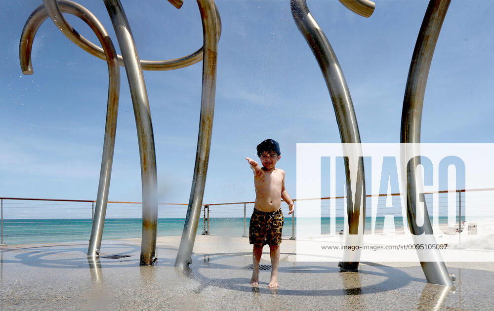 HOT WEATHER ADELAIDE, Jordan aged 5, plays in water fountains at Henley Beach during hot weather in Adelaide, Wednesday, November 20, 2019. More than 100 schools will be closed in South Australia today, as much of the state braces for catastrophic fire danger conditions. ( NO ARCHIVING, , NO USE IN BOOKS WITHOUT CONSENT ADELAIDE SA AUSTRALIA
