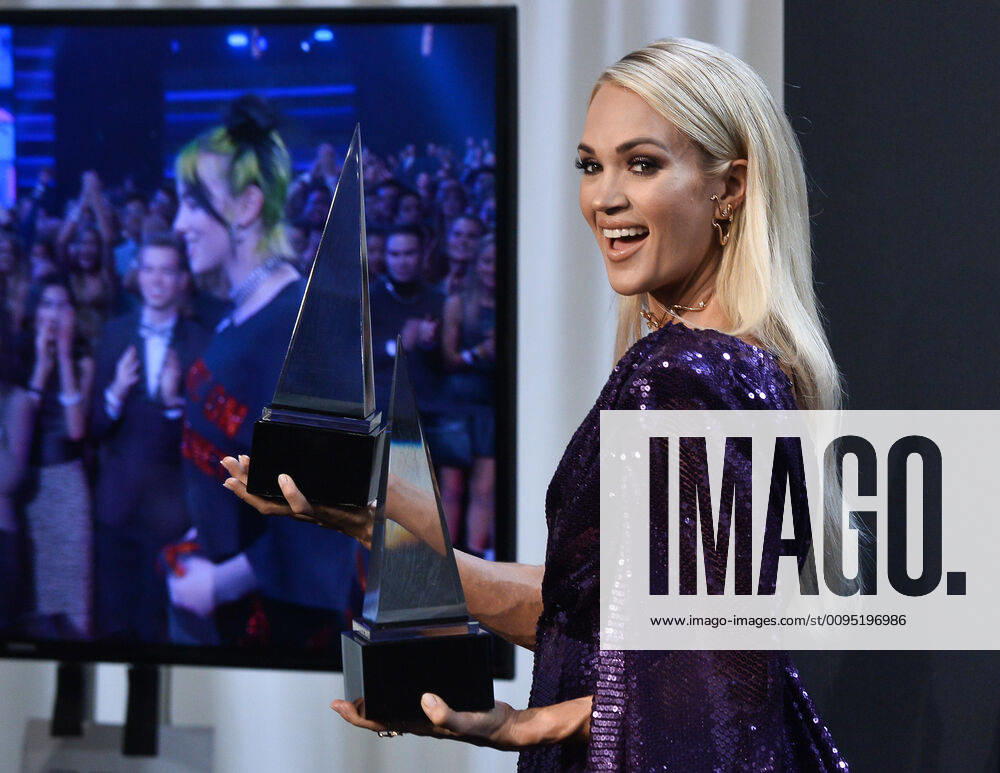 Singer Carrie Underwood appears backstage with her awards for Favorite Album - Country and the Favorite Female Artist - Country, during the 47th annual American Music Awards at the Microsoft Theater in Los Angeles on Sunday, November 24, 2019. LAP20191124327 JIMxRUYMEN
